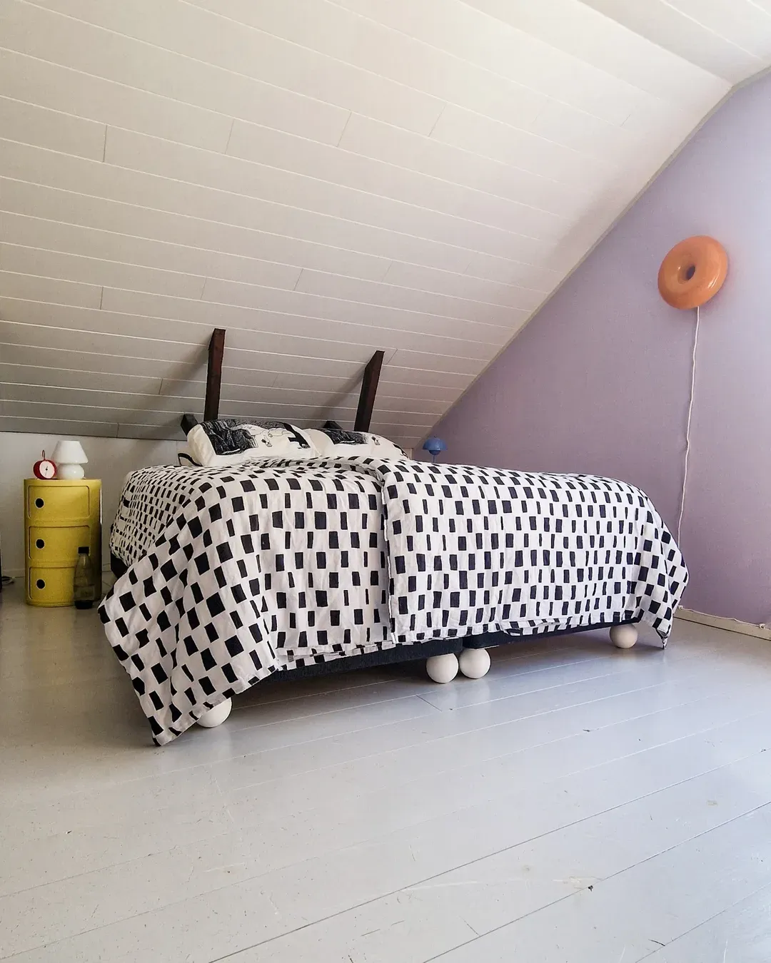 IKEA bed with round ball legs in a playful and creative bedroom design
